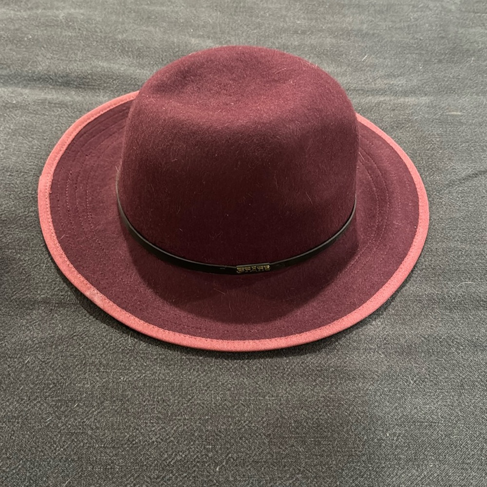Woman’s maroon hat
